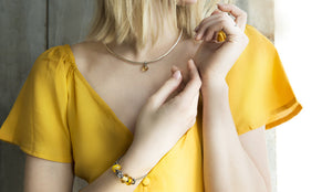 Model wearing Neck Bangle and trollbeads bracelet with beads